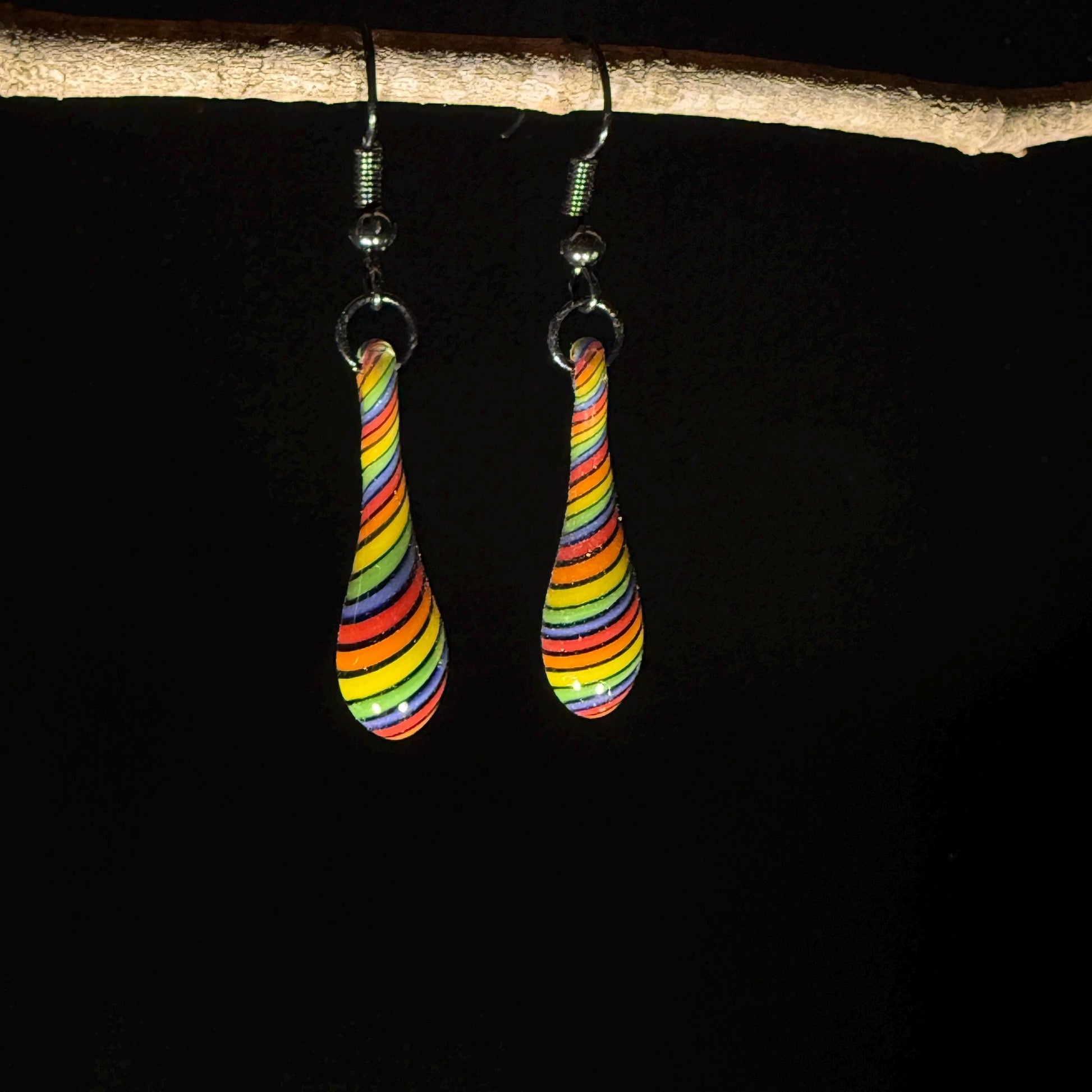 One of a Kind, Handcrafted Blown Glass Earrings. Rainbow drop style earrings. Handmade by a small-town artist in Honor, Michigan. They are Lightweight and hypoallergenic earrings that make a wonderful, colorful treat for anyone who receives them
